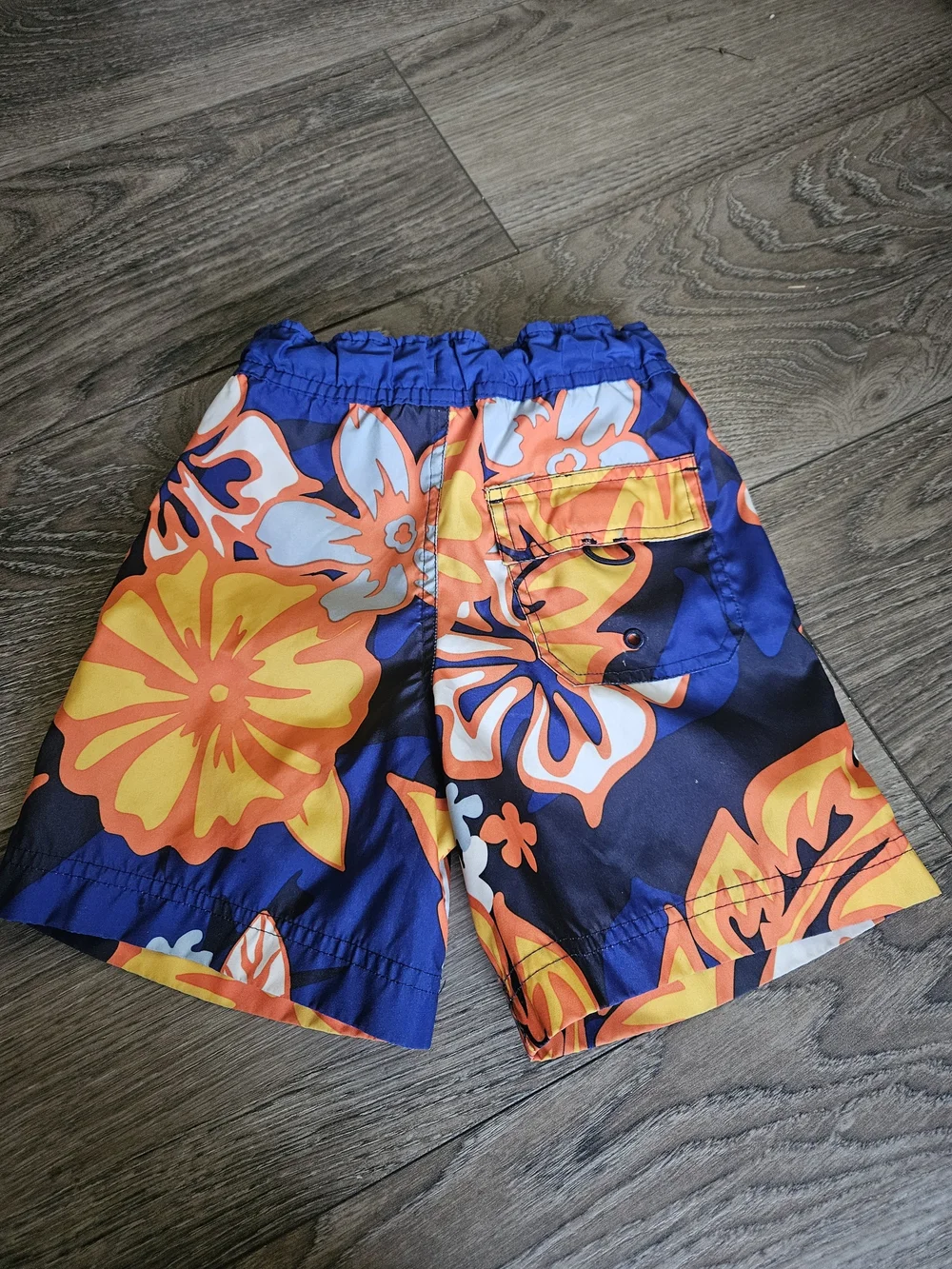 Pair Of Spider-Man Red Swim Trunks and Blue-Orange Floral Swim Shorts - Kids